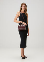 Fall/Winter 2025 styling of Givenchy Mini Antigona Burgundy Bag