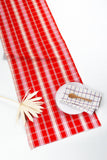 Handwoven Camila plaid table runner in red, pink, and white cotton