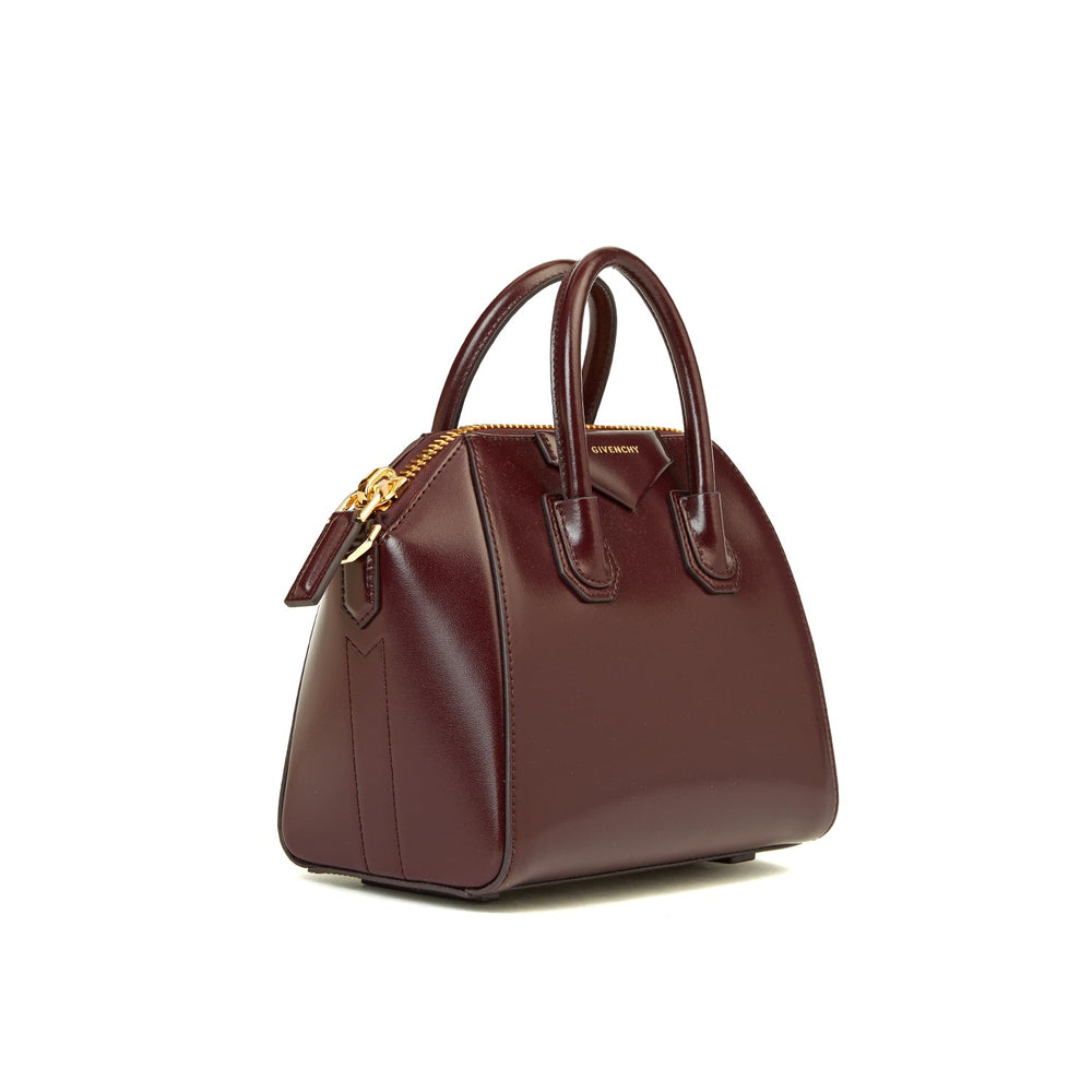 Close-up of zip-top and logo detail of Givenchy Mini Antigona