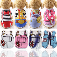 Small dog wearing summer cartoon print vest shirt outside on a sunny day