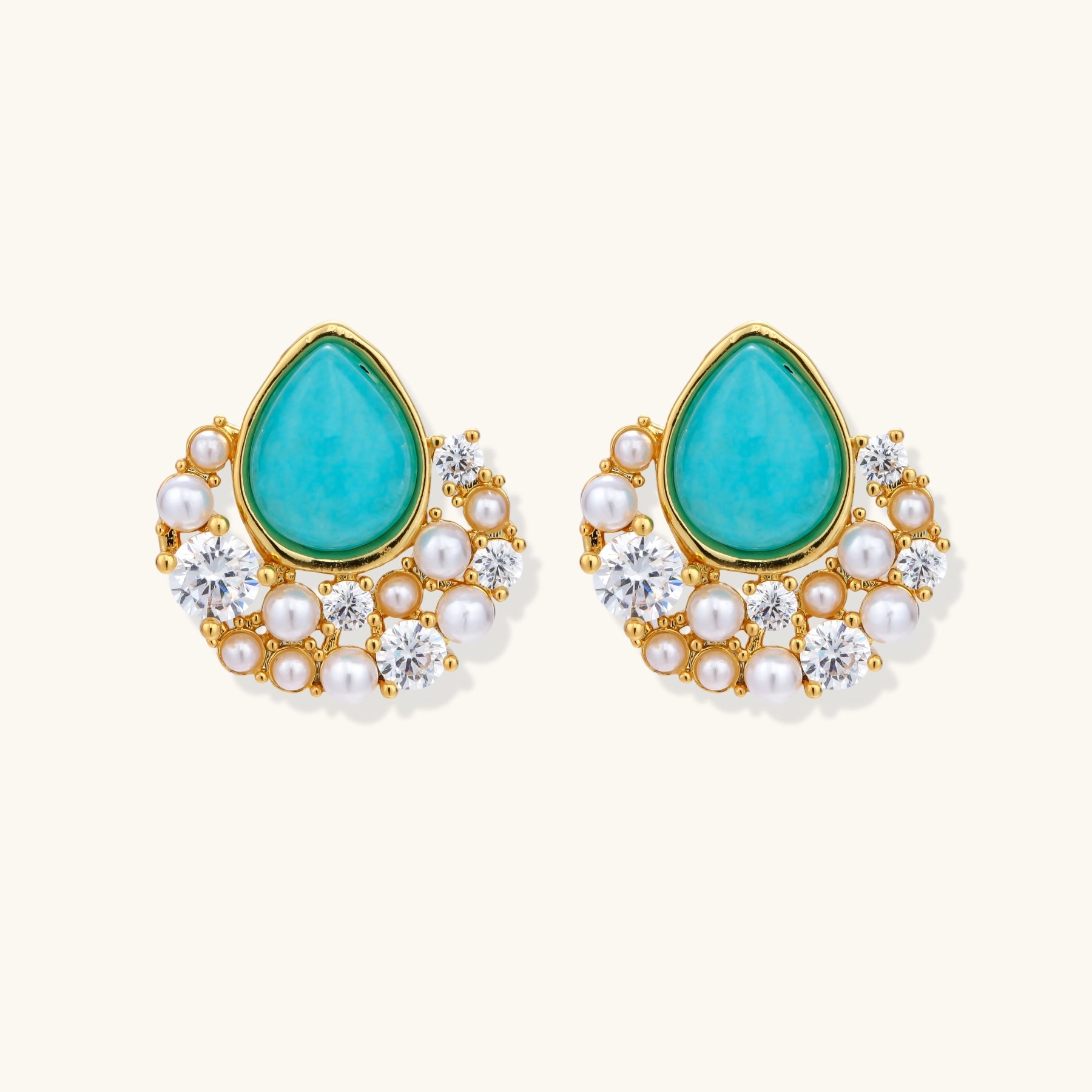 Gold-plated cluster earrings with teardrop turquoise stones surrounded by white pearls and clear crystals