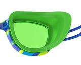 Colorful swim goggles with a green lens on a white background