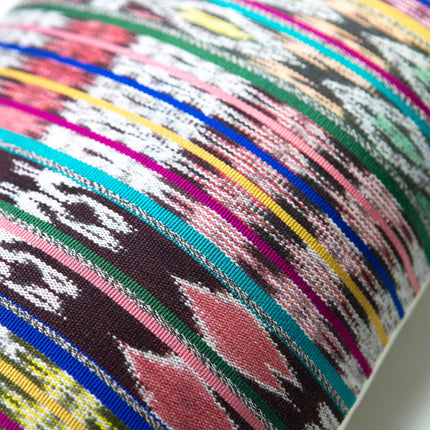 Vintage ikat pillow made from handwoven cotton fabric with multicolor pattern