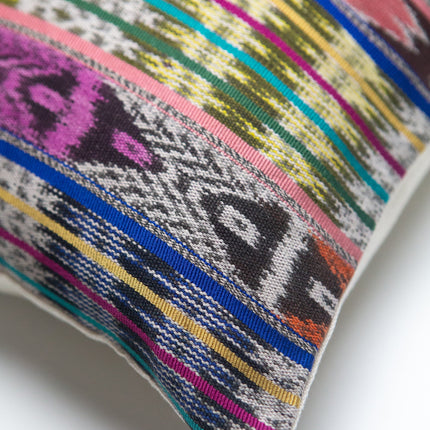 Vintage ikat pillow made from handwoven cotton fabric with multicolor pattern