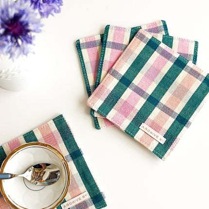Handwoven multicolor plaid coasters made by artisans in Guatemala