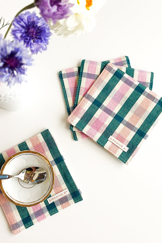 Handwoven multicolor plaid coasters made by artisans in Guatemala