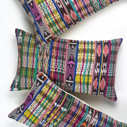 Vintage ikat pillow made from handwoven cotton fabric with multicolor pattern