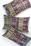 Vintage ikat pillow made from handwoven cotton fabric with multicolor pattern