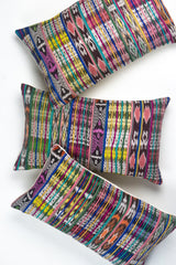 Vintage ikat pillow made from handwoven cotton fabric with multicolor pattern